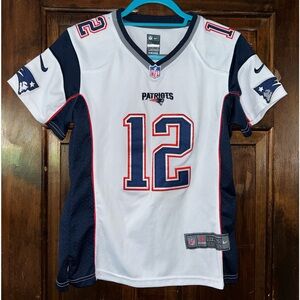 Authentic Nike On Field Tom Brady jersey in a women’s size small. Pre-owned.